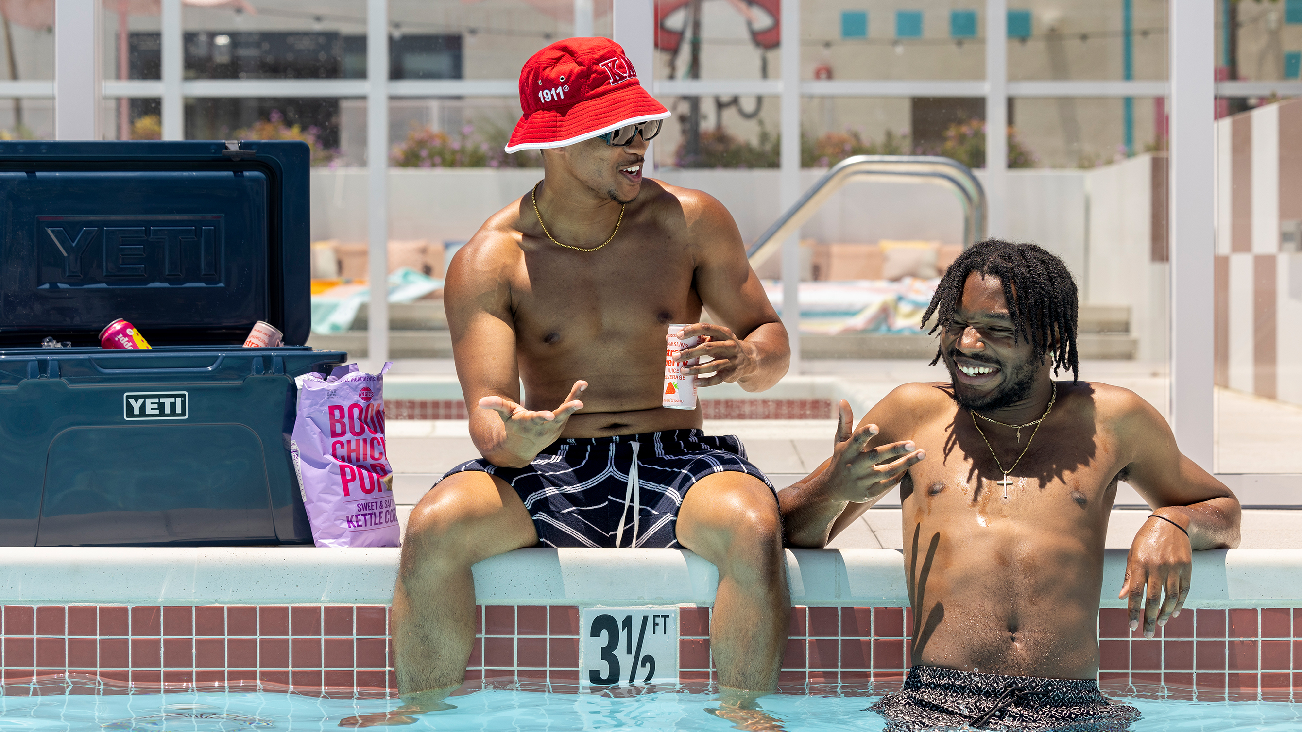 Friends hanging out by the swimming pool